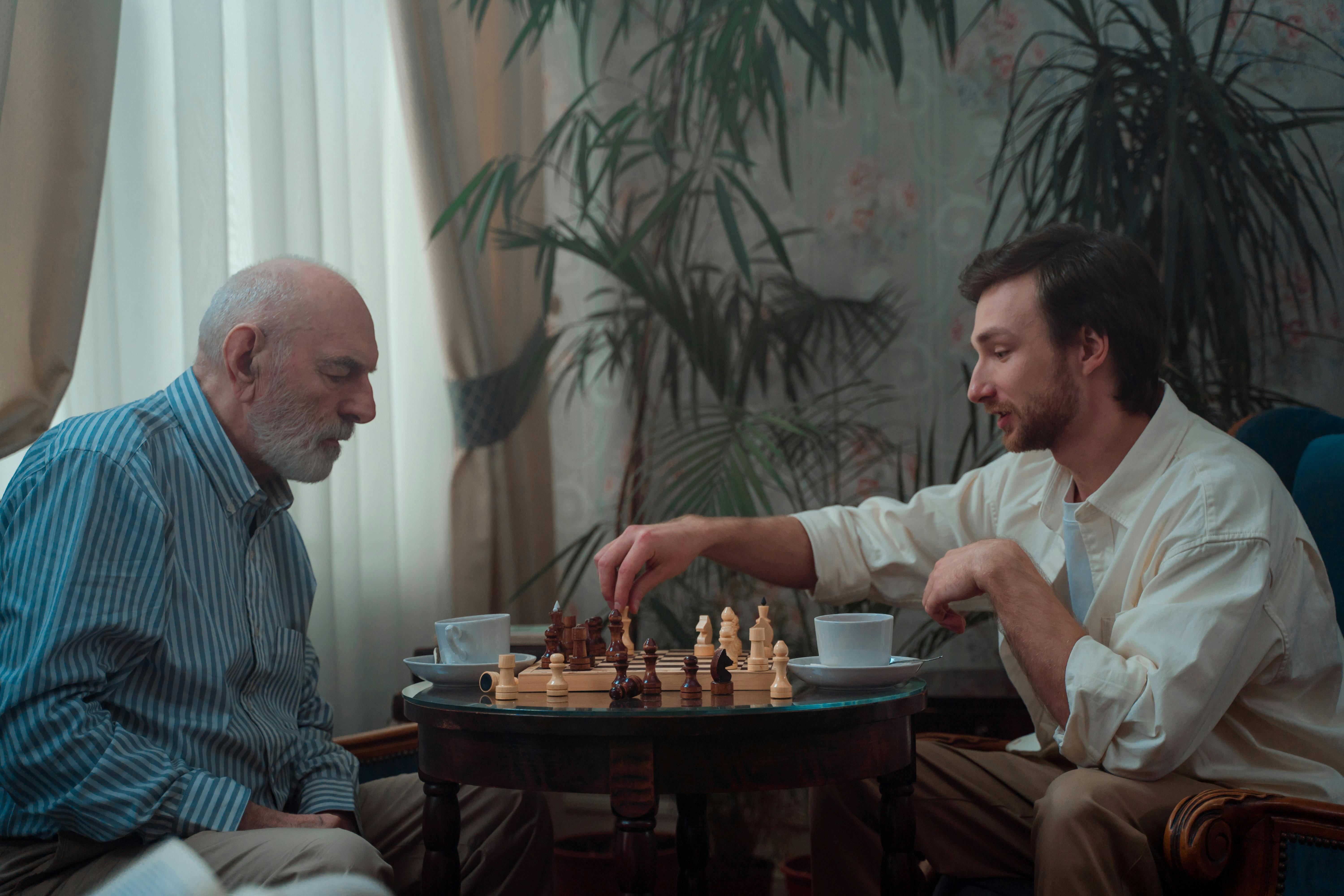 Club in Action 2, an old man playing chess with a younger man