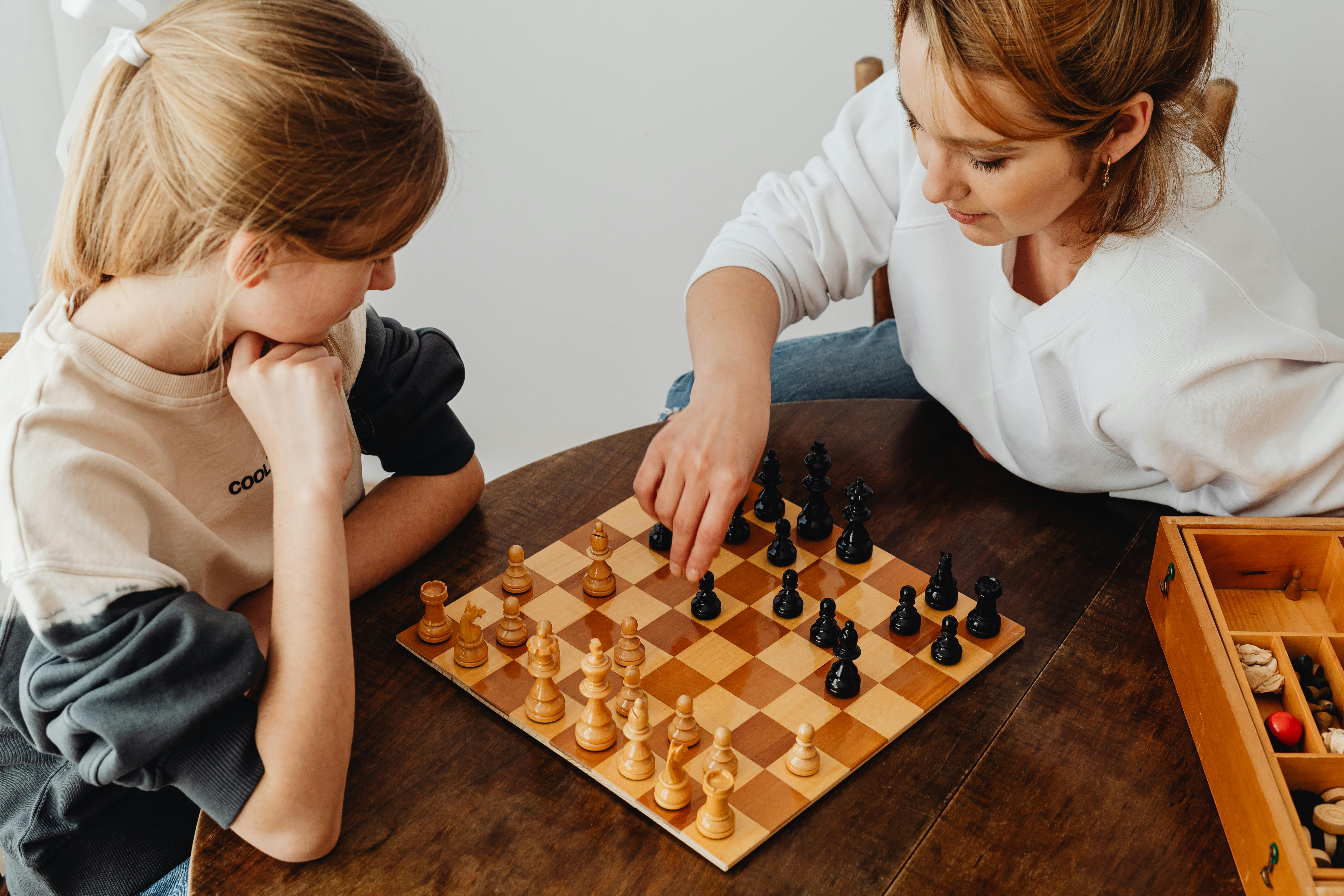 Club in Action 5, woman and young girl playing chess
