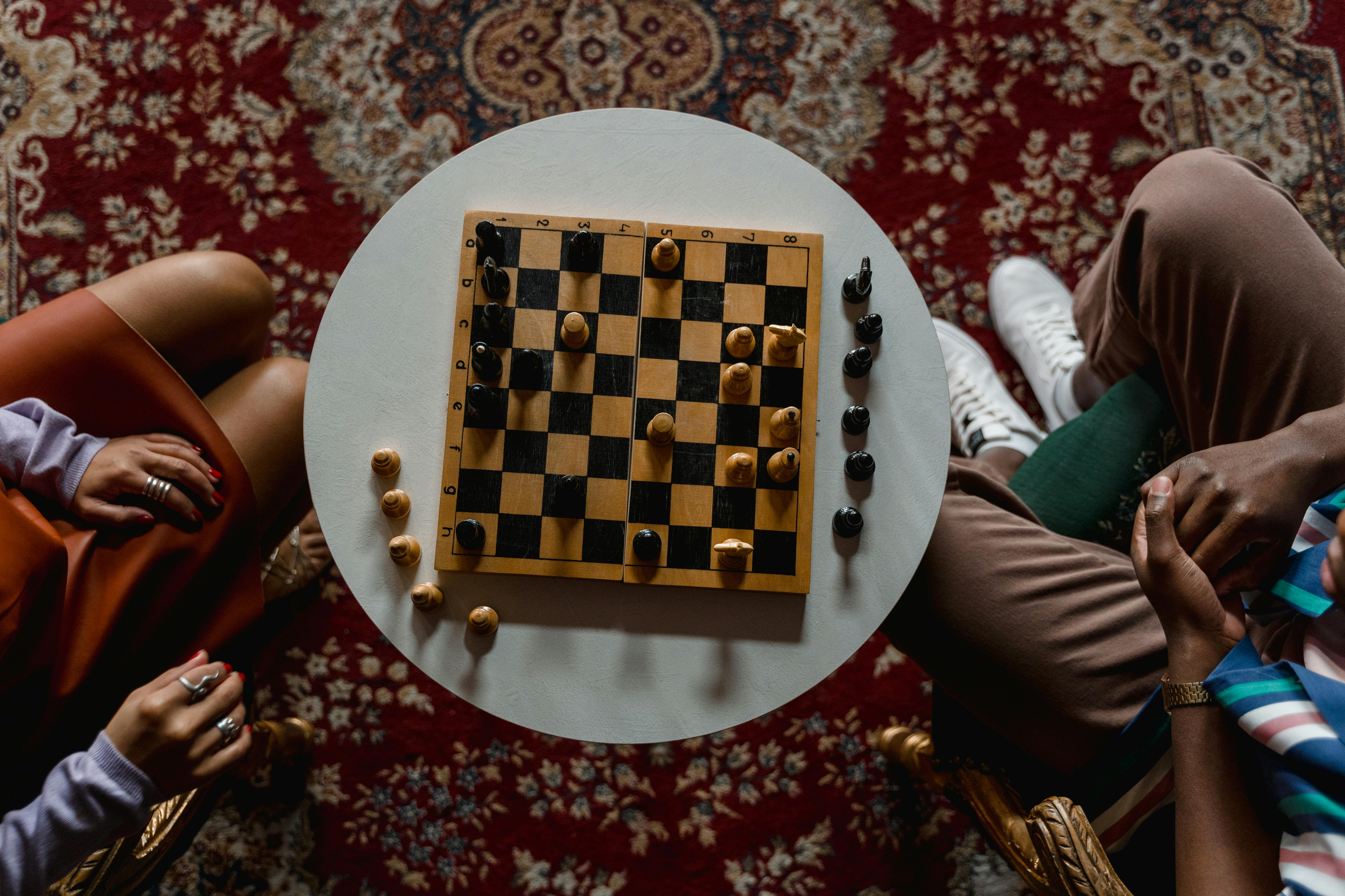 Club in Action 4, man and woman playing chess seen from above